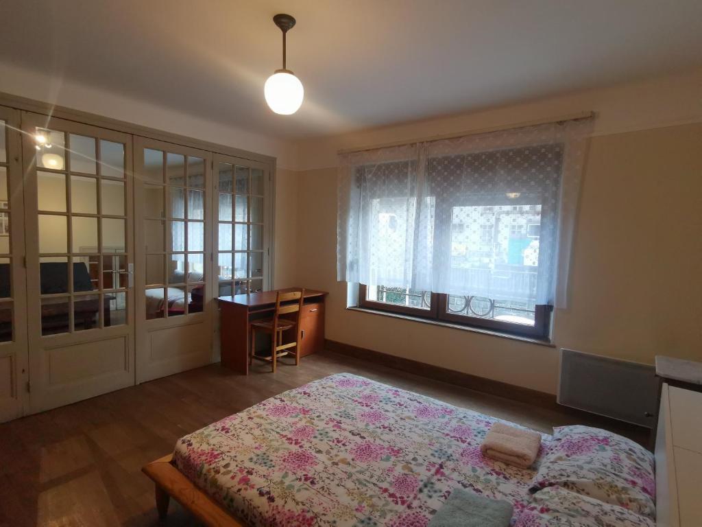 Postel nebo postele na pokoji v ubytování Appartements au bord de la rivière