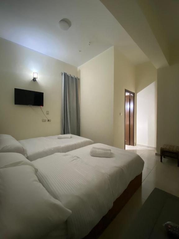 Postel nebo postele na pokoji v ubytování Sneferu Hotel