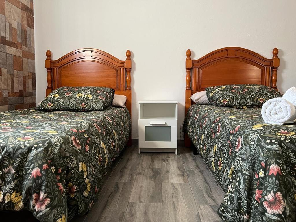 Postel nebo postele na pokoji v ubytování las camelias