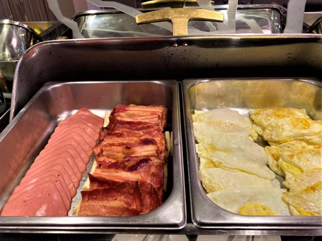 a tray of food with meat and other foods at Link World Hotel in Taipei