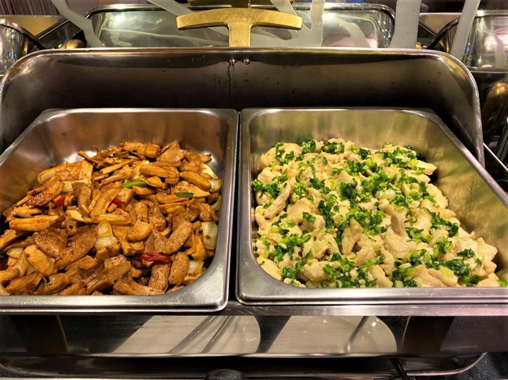 two metal trays filled with different types of food at Link World Hotel in Taipei