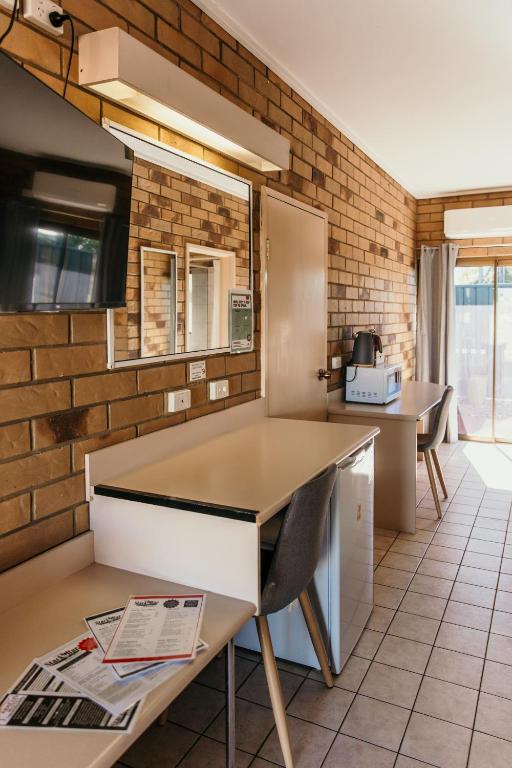 TV a/nebo společenská místnost v ubytování Abacus Motel