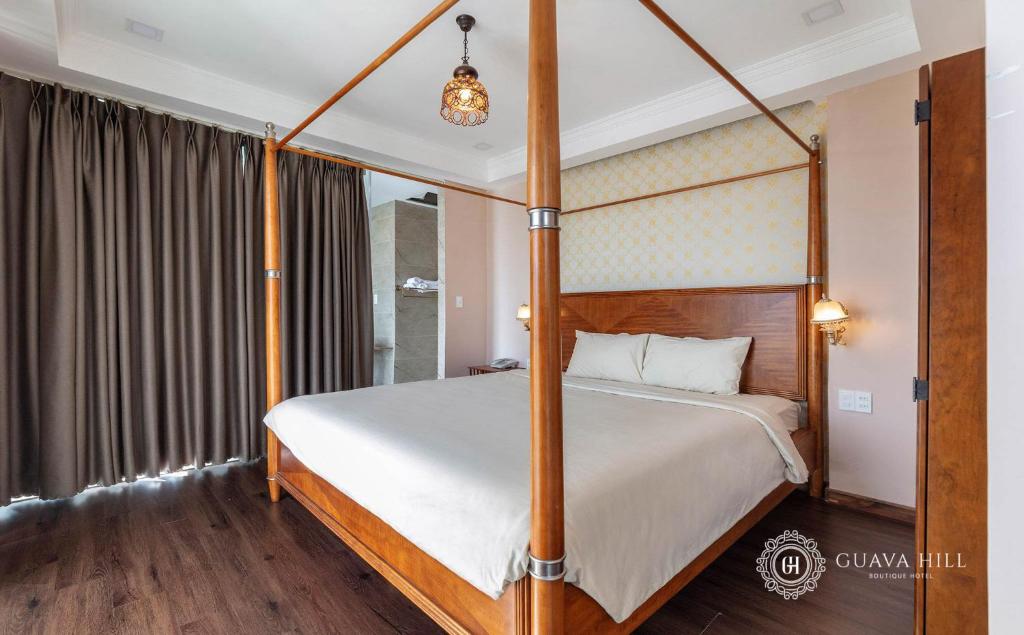 Postel nebo postele na pokoji v ubytování Guava Hill Boutique Hotel