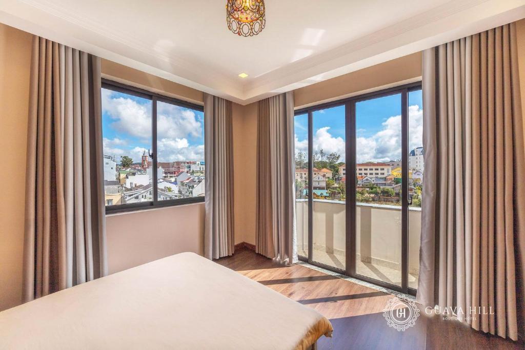Postel nebo postele na pokoji v ubytování Guava Hill Boutique Hotel