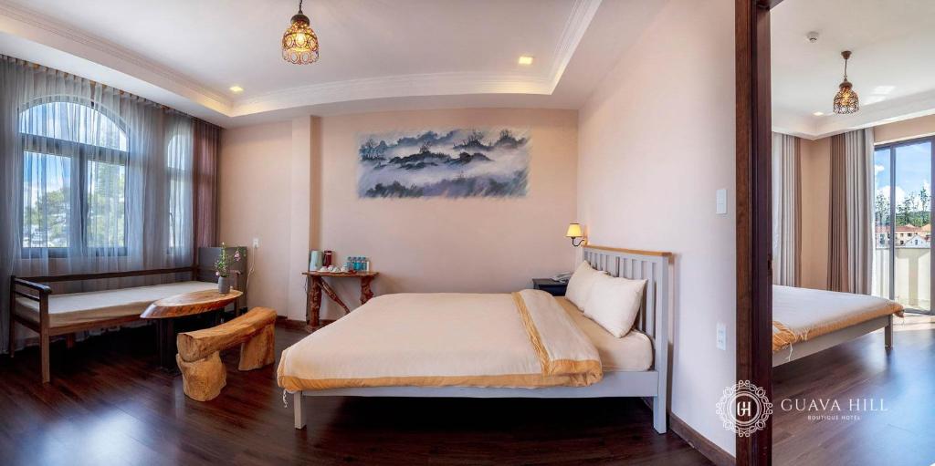 Postel nebo postele na pokoji v ubytování Guava Hill Boutique Hotel