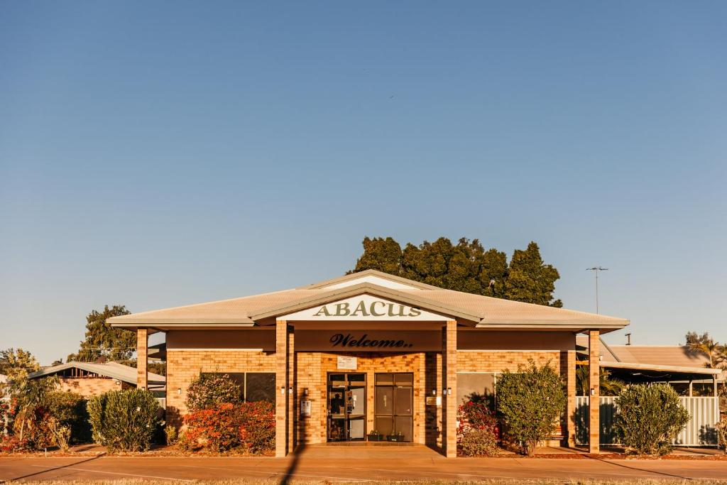 aania building with a sign on the front of it at Abacus Motel in Mount Isa