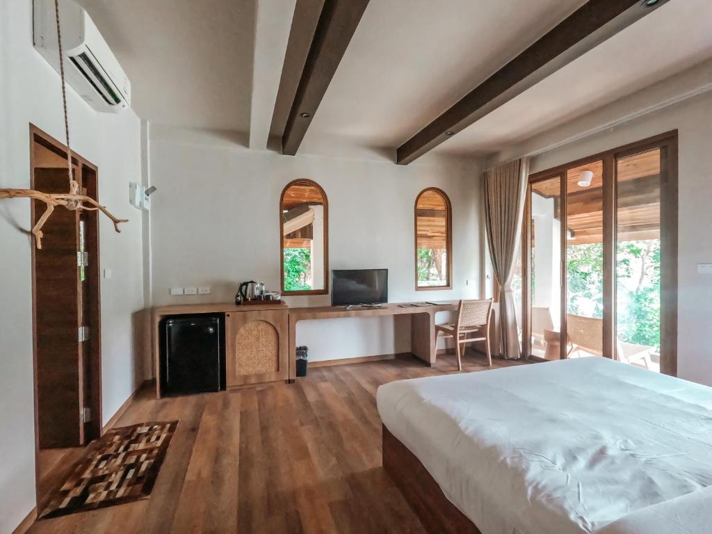 Postel nebo postele na pokoji v ubytování Resolution Resort
