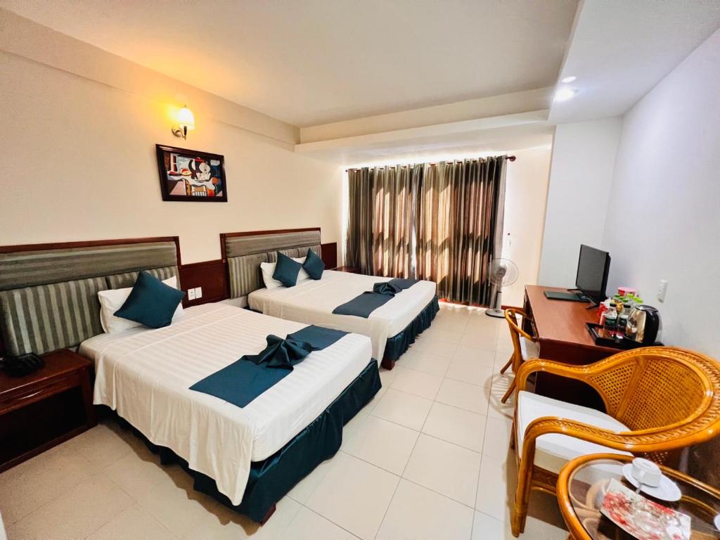 Postel nebo postele na pokoji v ubytování The Coast Hotel Vung Tau