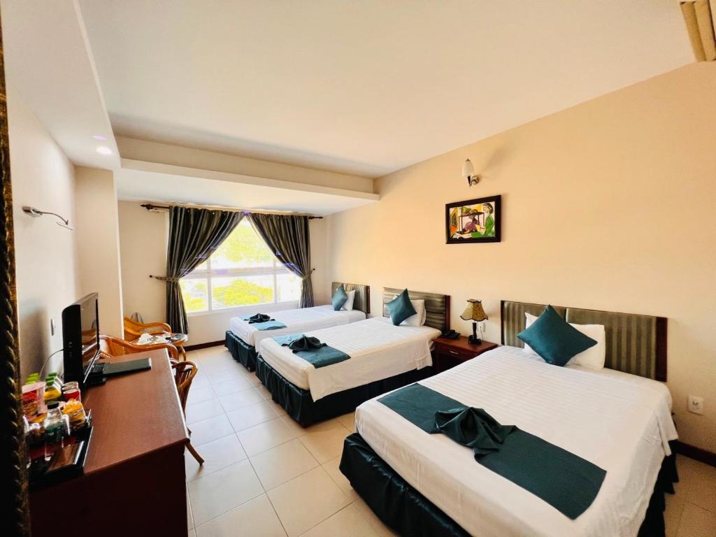Postel nebo postele na pokoji v ubytování The Coast Hotel Vung Tau