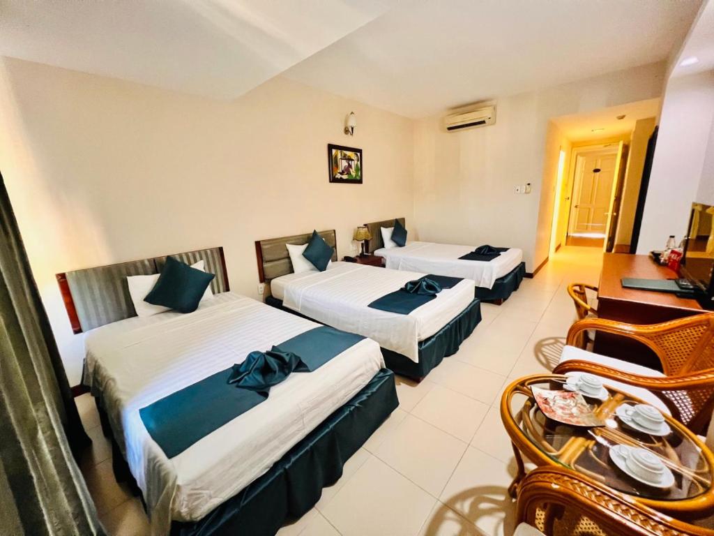 Postel nebo postele na pokoji v ubytování The Coast Hotel Vung Tau