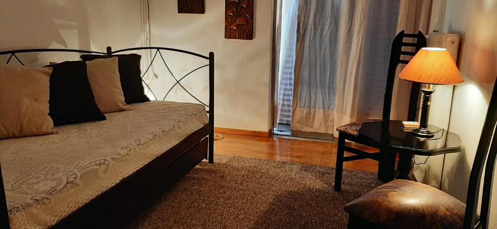 A bed or beds in a room at Koukaki View