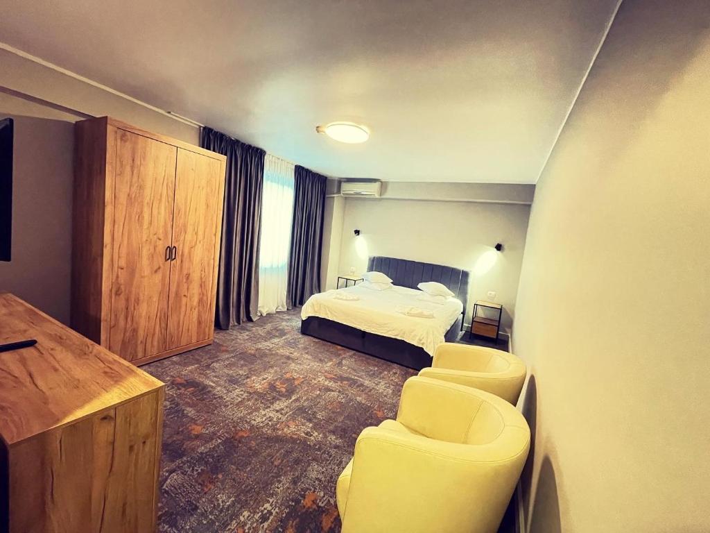 Postel nebo postele na pokoji v ubytování Hotel City