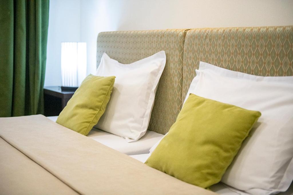 Postel nebo postele na pokoji v ubytování Apart Hotel GH