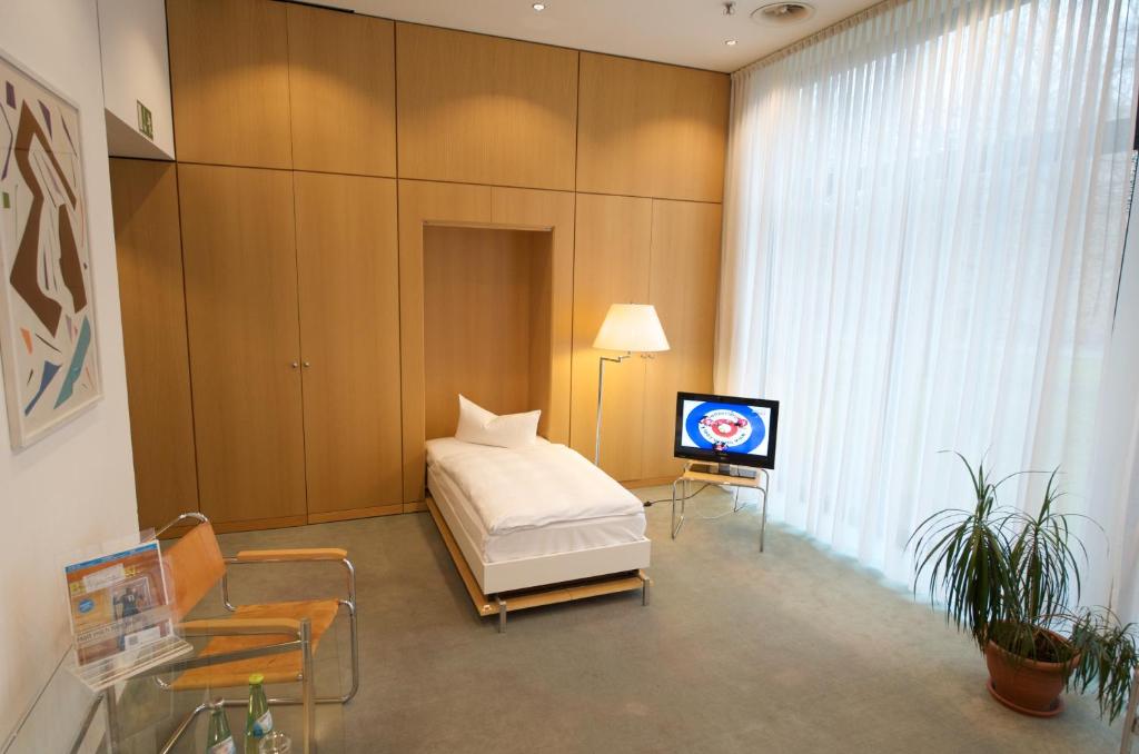 TV a/nebo společenská místnost v ubytování Holiday Inn Berlin City-West by IHG