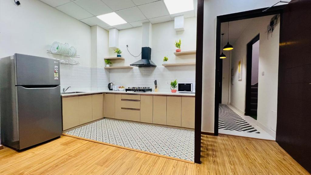 Kuchyň nebo kuchyňský kout v ubytování Olive Service Apartments - City Centre Noida