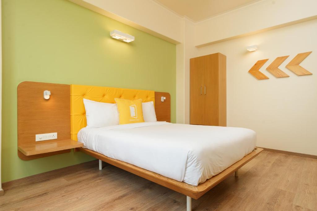 Postel nebo postele na pokoji v ubytování Bloom Hotel - Sector 62