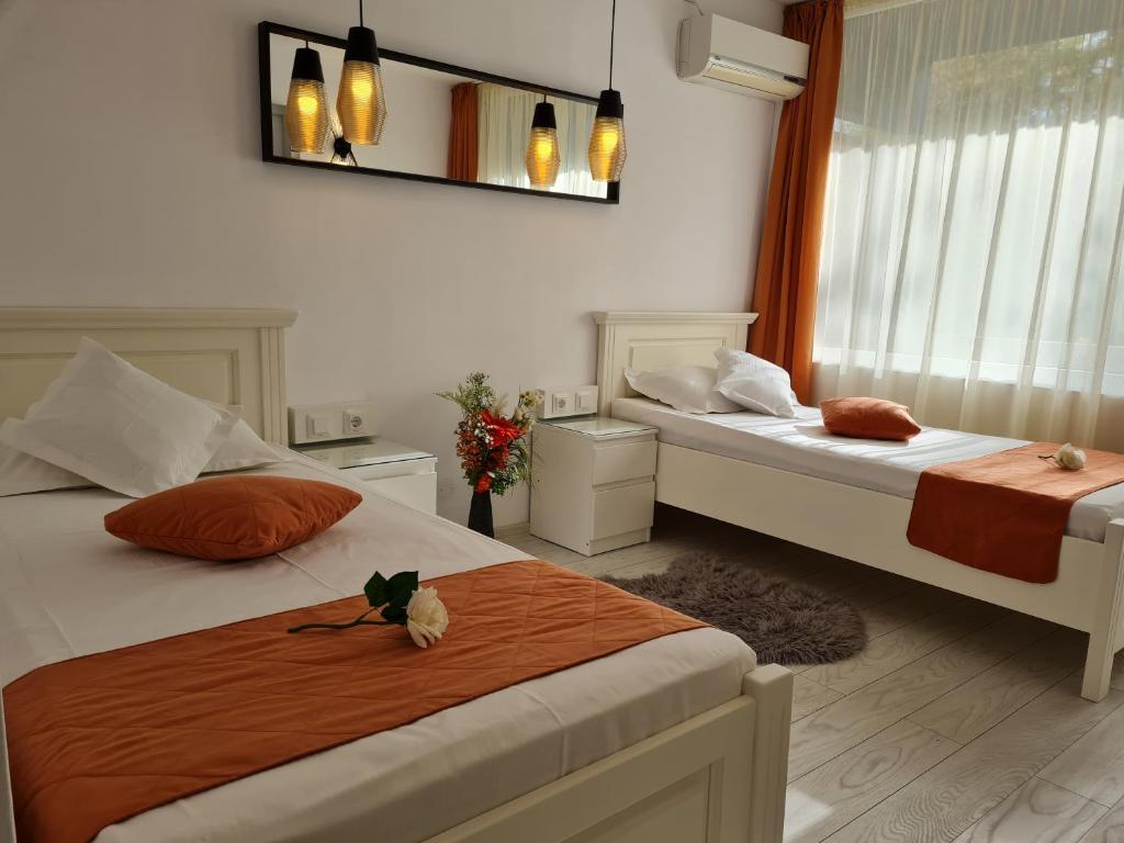Postel nebo postele na pokoji v ubytování Hotel Sunquest