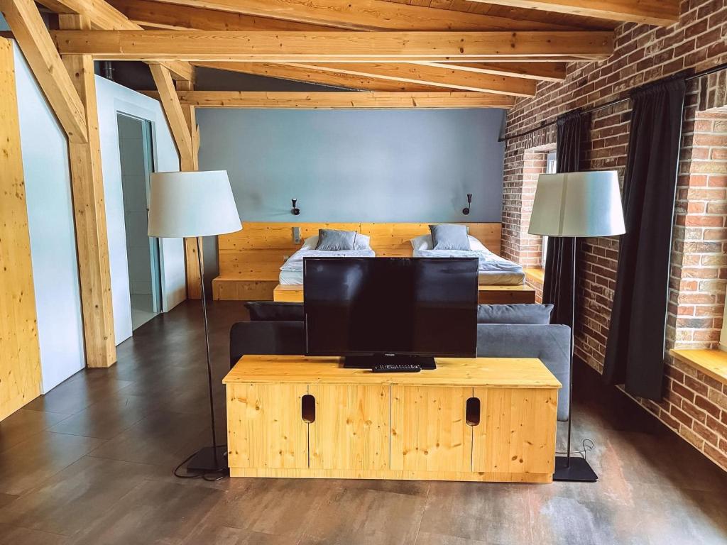 Postel nebo postele na pokoji v ubytování Pivovar Kocour