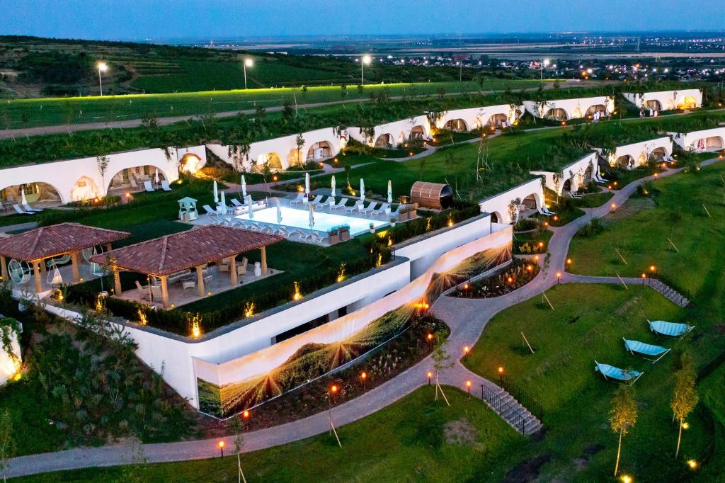 an aerial view of a building with a swimming pool at Casa Timiș - Wellness & Spa Resort in Chiţorani