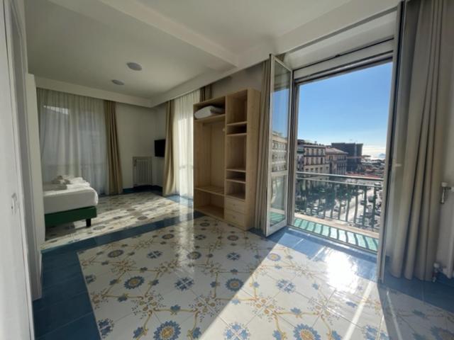 Postel nebo postele na pokoji v ubytování Napolit'amo Hotel Medina
