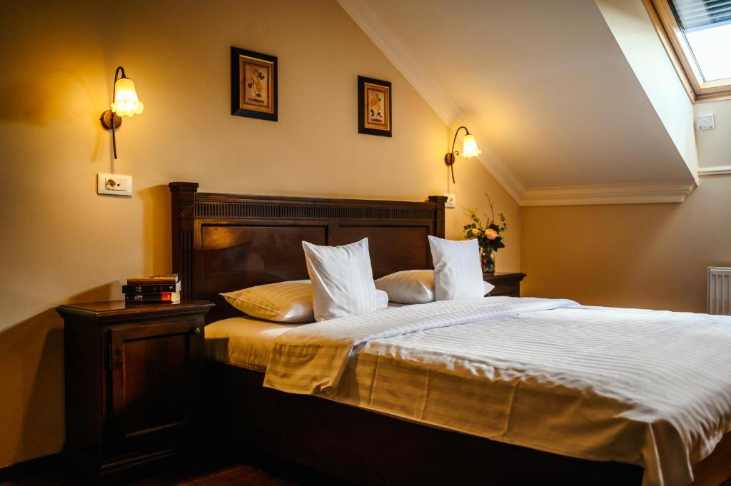 Postel nebo postele na pokoji v ubytování Aparthotel Iosefin Residence