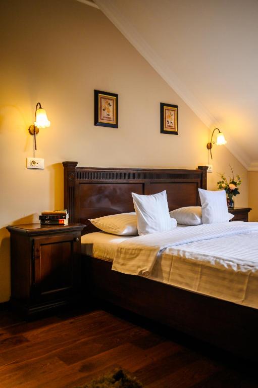Postel nebo postele na pokoji v ubytování Aparthotel Iosefin Residence
