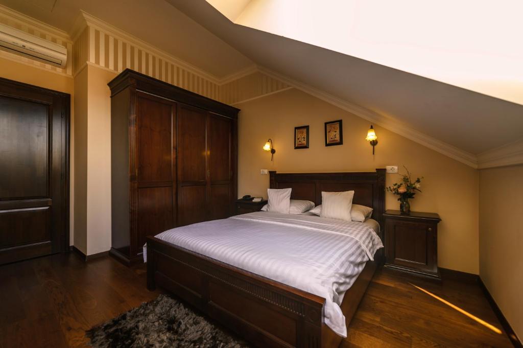 Postel nebo postele na pokoji v ubytování Aparthotel Iosefin Residence
