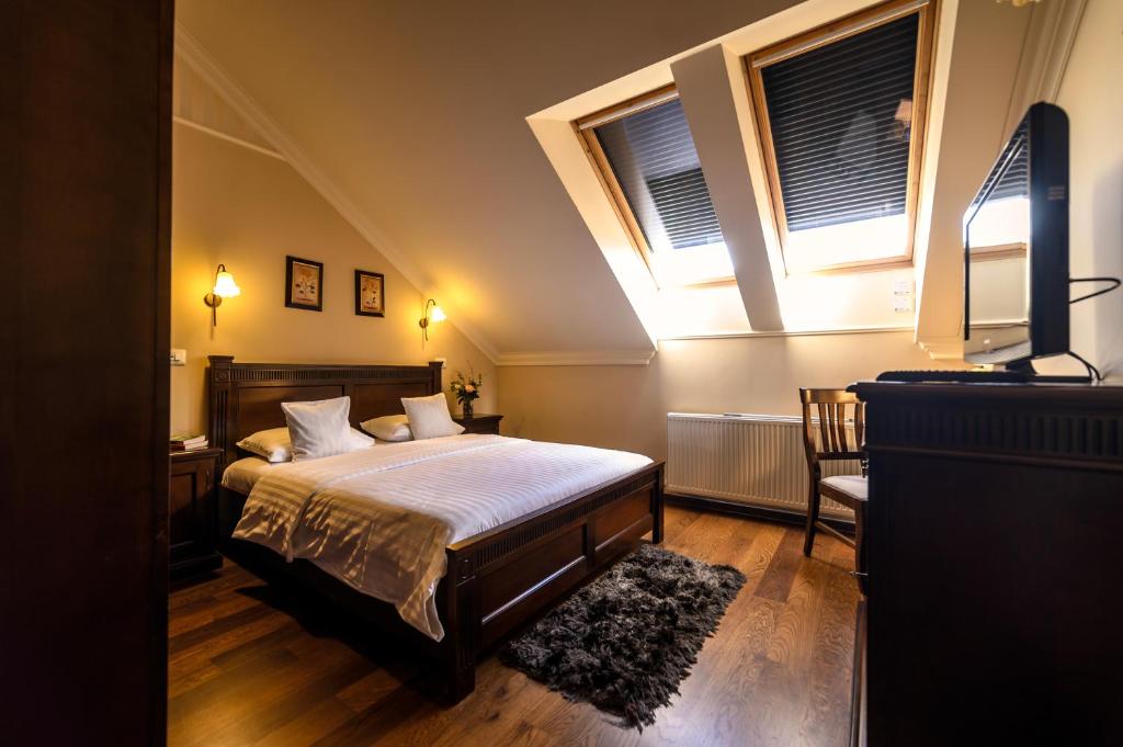 Postel nebo postele na pokoji v ubytování Aparthotel Iosefin Residence