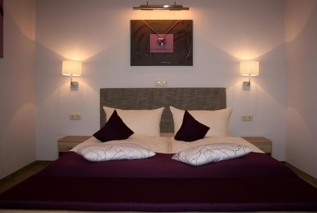 Postel nebo postele na pokoji v ubytování DAS HUDEWALD Hotel & Resort