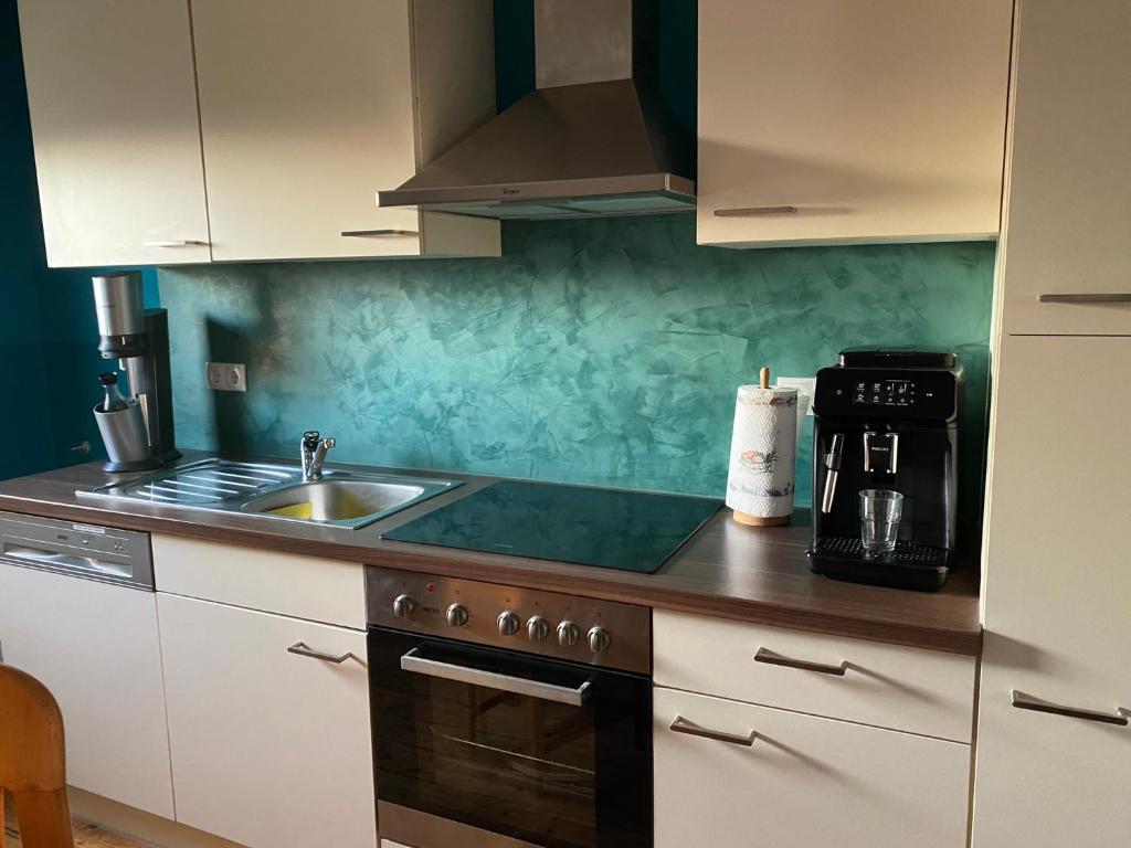 Kuchyň nebo kuchyňský kout v ubytování Ferienwohnung Hamburg - Kirchwerder