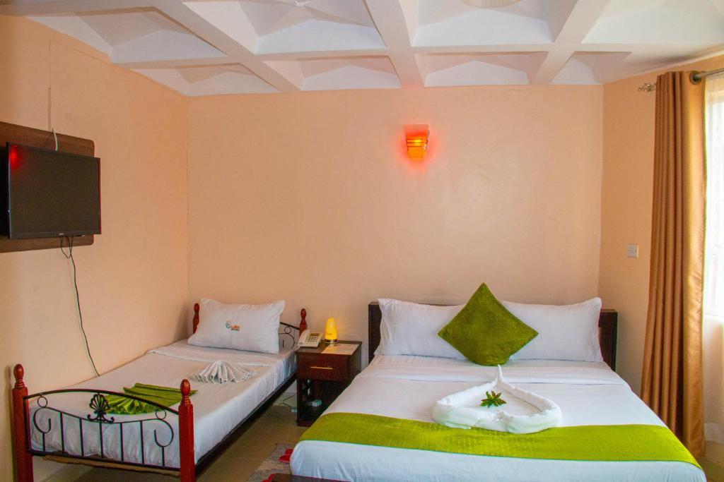 Postel nebo postele na pokoji v ubytování Luna hotel