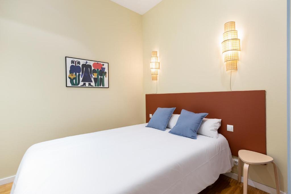 Postel nebo postele na pokoji v ubytování Señor Urgell Apartment by Olala Homes