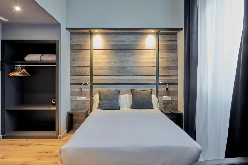Postel nebo postele na pokoji v ubytování Hotel Parada Puigcerda