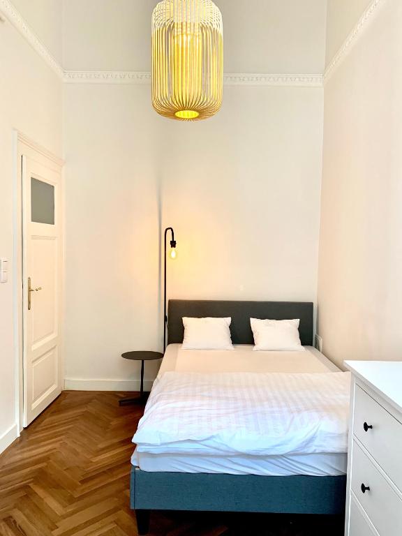 Posteľ alebo postele v izbe v ubytovaní Central Basilica Apartman