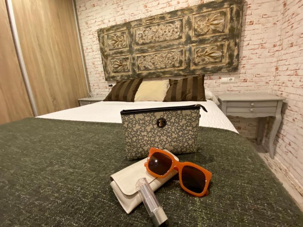 Posteľ alebo postele v izbe v ubytovaní Apartamentos Sevilla Palace