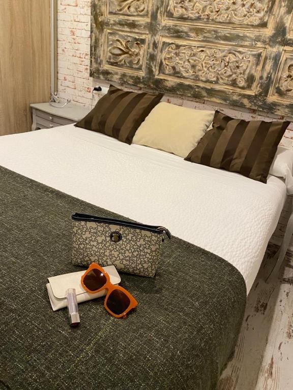 Posteľ alebo postele v izbe v ubytovaní Apartamentos Sevilla Palace