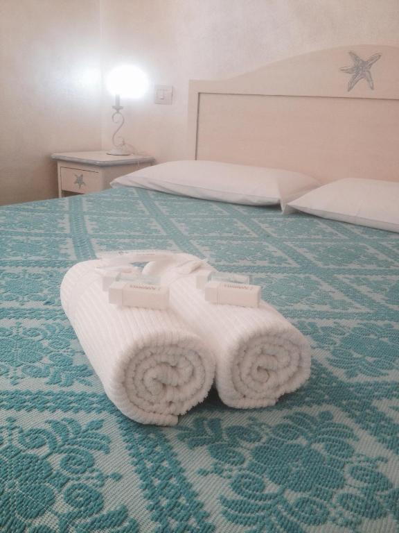 Postel nebo postele na pokoji v ubytování Morpheo Rooms