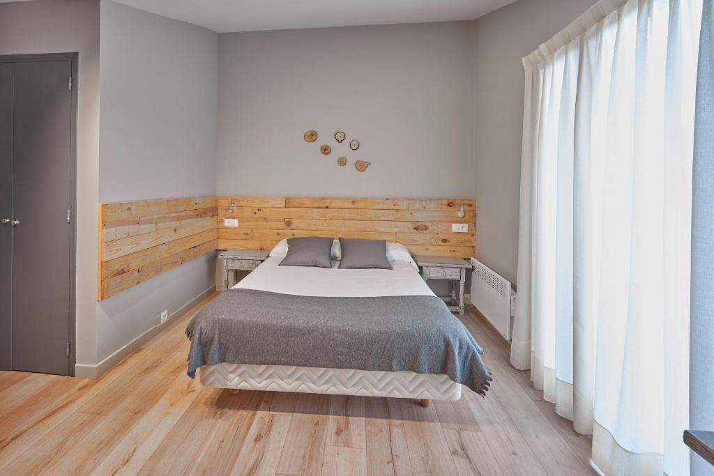 Postel nebo postele na pokoji v ubytování L'Oree du Bois