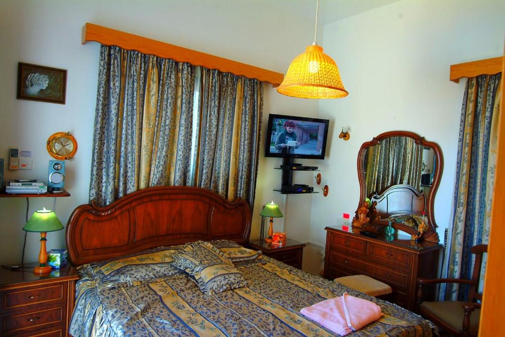 Postel nebo postele na pokoji v ubytování Astrofegia Beachfront Villa