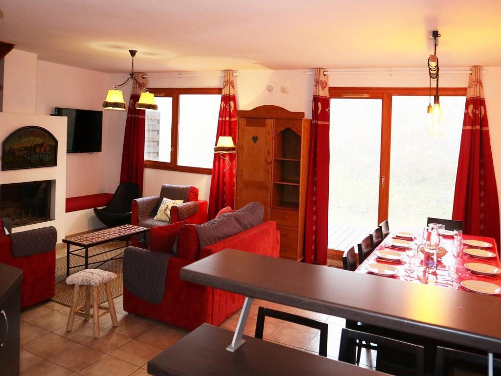 a living room with a table and chairs at Chalet Les Orres, 5 pièces, 10 personnes - FR-1-322-65 in Les Orres