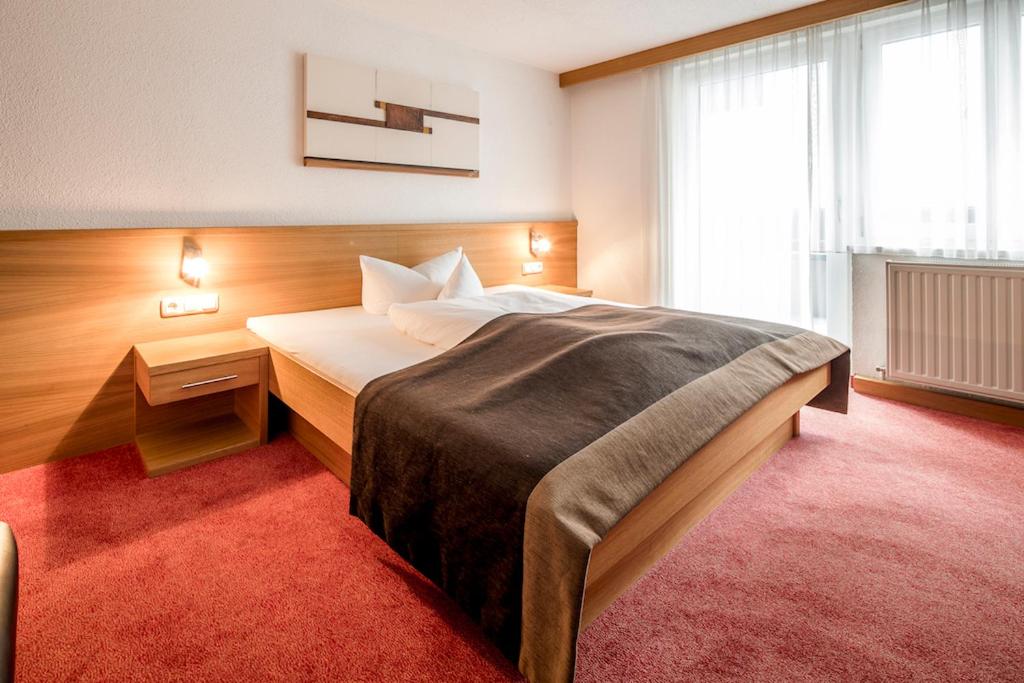 Postel nebo postele na pokoji v ubytování Ferienhaus & Apart Post