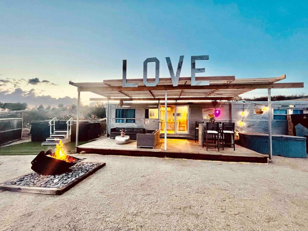 love In The Cloudspool Fire Pit View
