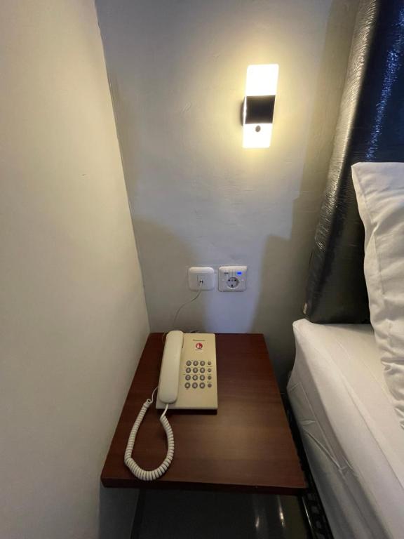 Postel nebo postele na pokoji v ubytování Liberta Home Seririt Bali