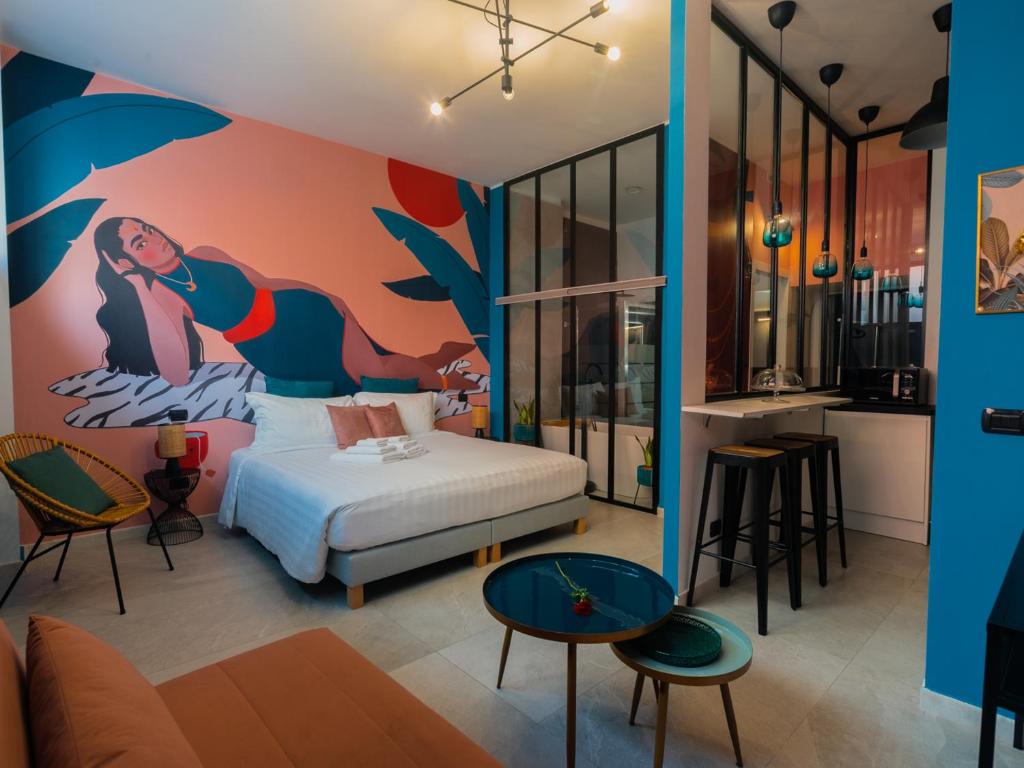 a hotel room with a bed and a mural at Milano Experience Home - Gauguin in Milan