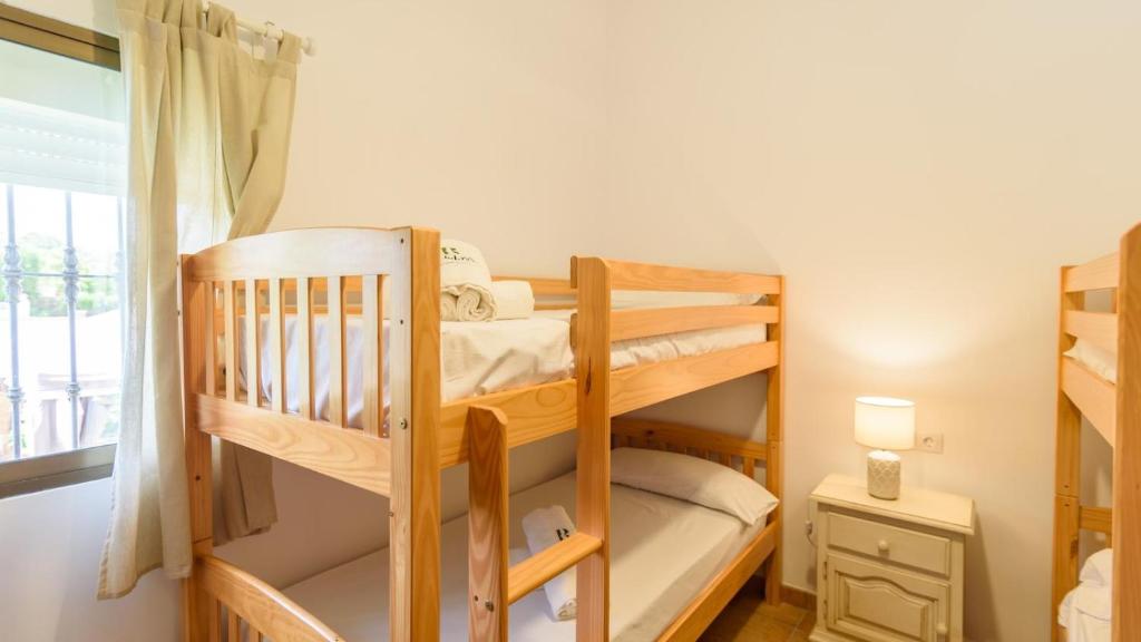 A bed or beds in a room at Casa rural cerca de Aracena Castillo de las Guardas by Ruralidays