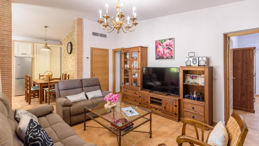 A television and/or entertainment centre at Casa rural cerca de Aracena Castillo de las Guardas by Ruralidays