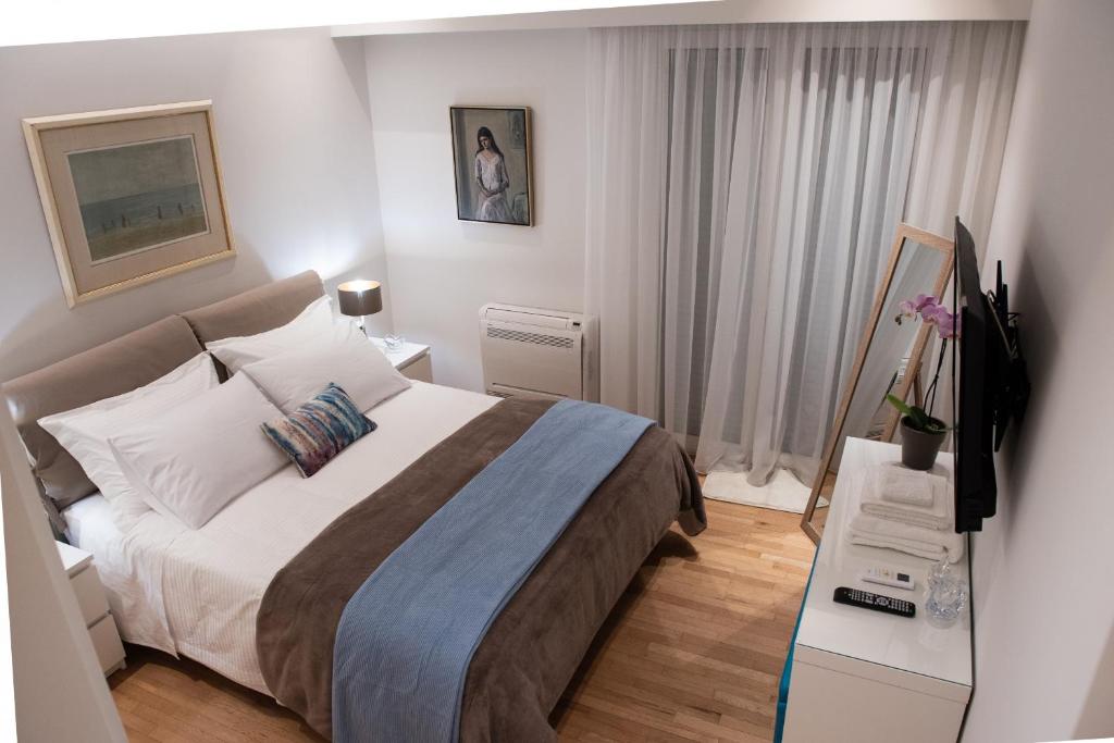 Posteľ alebo postele v izbe v ubytovaní Katia Modern Apartment in Athens