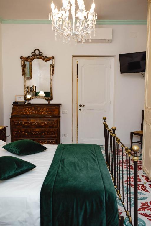 A bed or beds in a room at Delfini Trevi House