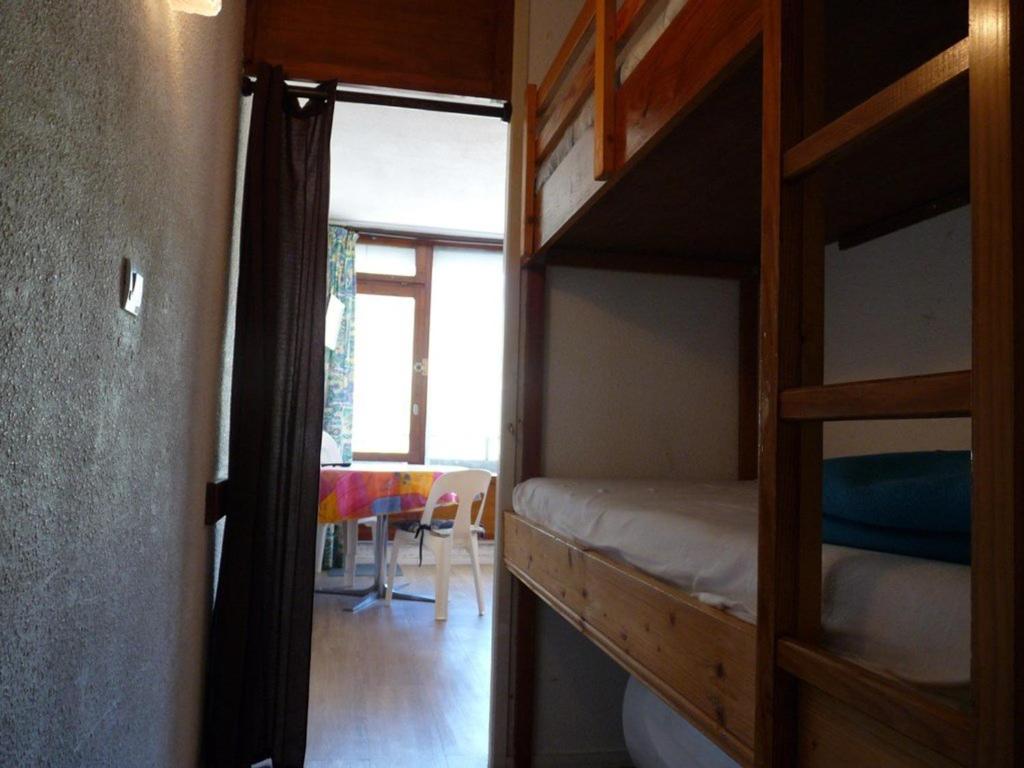 a room with two bunk beds and a table at Studio Arette, 1 pièce, 4 personnes - FR-1-602-70 in Arette