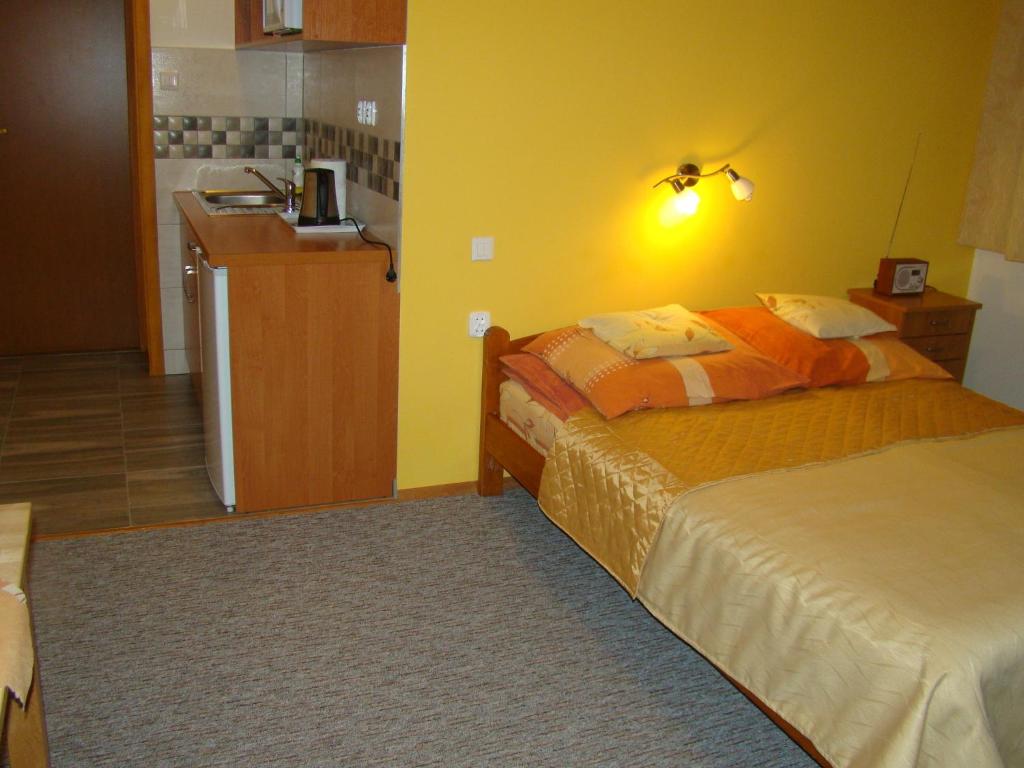 Postel nebo postele na pokoji v ubytování Willa Stenia Apartamenty